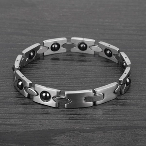 Bracciale magnetico da uomo in acciaio spazzolato con perle nere rotanti