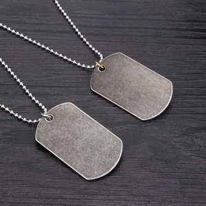 Vintage US Marine Corps style dog tag pendant necklace with silver and gold connectors