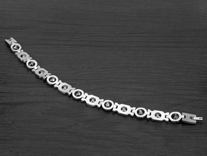 Close-up of stainless steel men's bracelet with carbon fiber magnetic diamond beads
