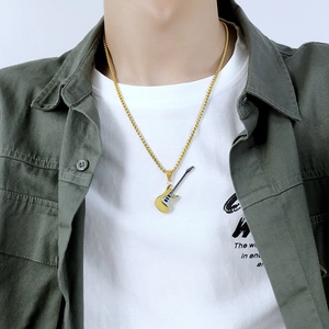 Close-up of golden electric guitar pendant necklace on male model with green shirt