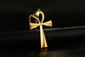 Polished gold stainless steel Ankh cross pendant with square link chain on black leather