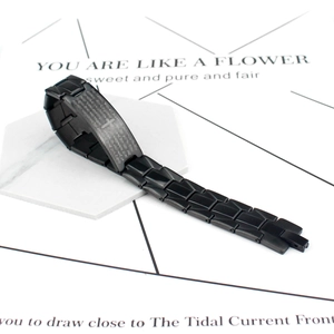 Men's minimalist black link chain bracelet featuring a curved metal bar and cross design