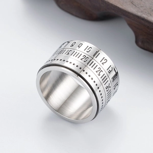 Macro view of rotating titanium steel ring with engraved numbers and industrial markings