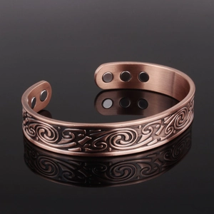 Vintage copper magnetic therapy bracelet with Nordic viking style spiral pattern engraving