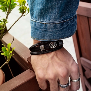 Men's multi-layer black braided leather bracelet featuring a silver Hexagram star charm