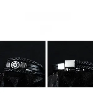 Detail of multi-layer woven leather bracelet with silver hexagram star and magnetic clasp