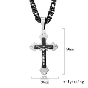 Detailed view of punk cross pendant with white rhinestones and its 58mm height dimension