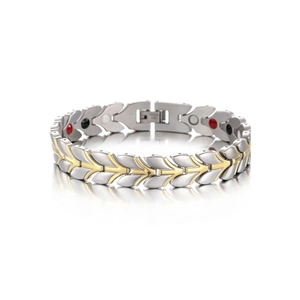 Macro detail of two-tone stainless steel magnetic bracelet with leaf design and fold-over clasp