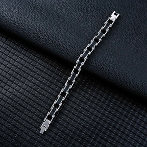 Industrial bike chain style stainless steel bracelet with black silicone inserts and fold clasp