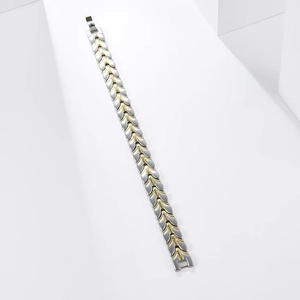 Detailed close-up of 12mm wheat chain steel bracelet with gold and silver links