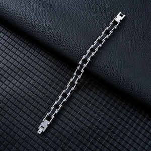 Men's stainless steel bicycle chain bracelet with black silicone inserts on leather