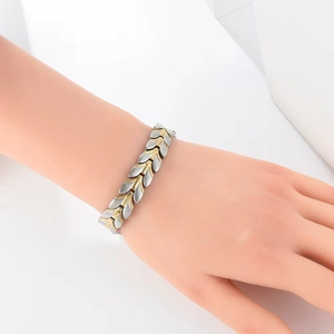 12mm wheat pattern titanium steel magnetic bracelet in gold and silver finish on wrist