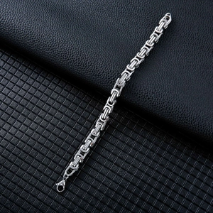 Macro view of silver Byzantine steel bracelet chain links and lobster clasp detail