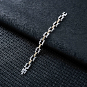 Detail of two-tone stainless steel motorcycle chain bracelet for men with folding clasp