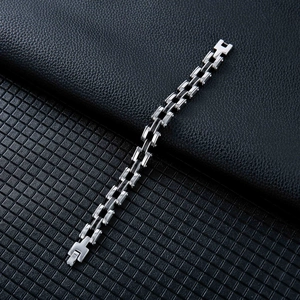 Macro shot of industrial titanium steel chain bracelet with secure folding clasp