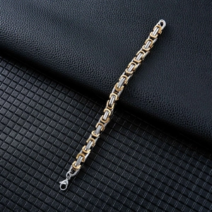 Detail of gold and silver Byzantine chain link bracelet with secure lobster clasp