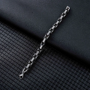 Close-up of industrial square Byzantine chain link bracelet with lobster clasp in silver and black