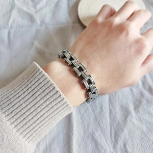 Men's multi-layer industrial titanium steel chain bracelet shown on a male wrist
