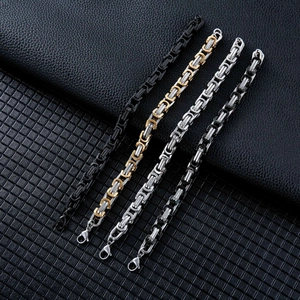 Men's titanium steel Byzantine chain bracelets in four colors on black leather background