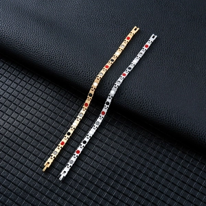 Detail view of gold and silver magnetic therapy bracelets with colorful energy stones