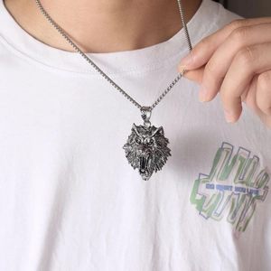 Retro punk wolf head pendant necklace in stainless steel on white t-shirt model