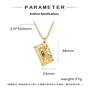Macro detail of a vintage gold cassette tape pendant with intricate mechanical textures