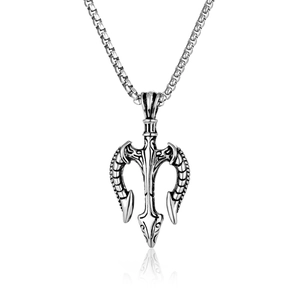 Macro detail of vintage stainless steel trident pendant with retro engraved texture