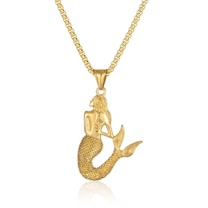 Golden mermaid pendant necklace with detailed scales on a polished rolo chain accessory