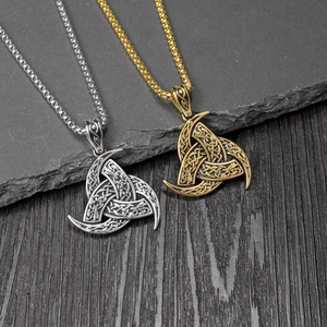 Nordic Viking Odin horn necklace with Triquetra and dragon symbols in silver and gold