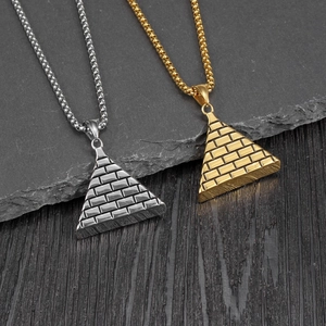 Vintage Egyptian pyramid pendant necklaces in gold and silver with Eye of Horus textures