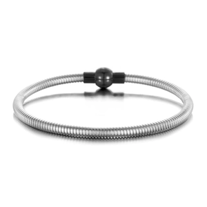 Detailed macro view of silver snake chain bracelet with glossy black spherical magnetic clasp