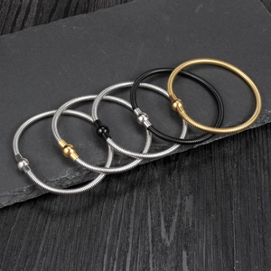 Five-piece spring snake chain bracelet set in silver, gold, and black stainless steel