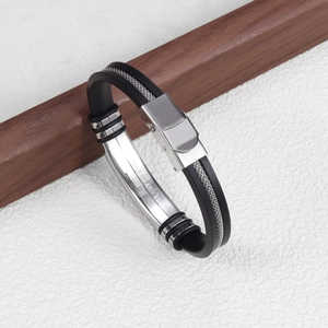 Detail showing stainless steel engraving on adjustable black silicone snake chain bracelet