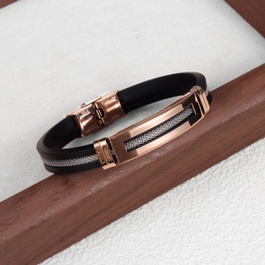 Close-up of black silicone bracelet with rose gold stainless steel mesh metal detail