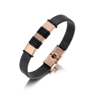 Detail of black leather bracelet with rose gold steel plates and a secure folding clasp