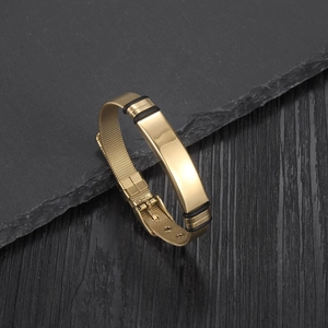 Detail of gold mesh strap bracelet with polished plate and adjustable pin buckle