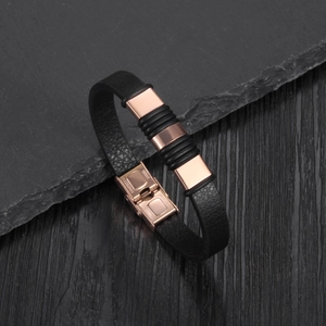 Detailed view of leather strap bracelet with rose gold stainless steel clasp and rubber rings