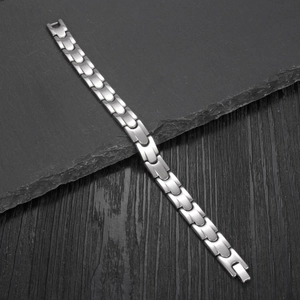 Minimalist stainless steel bullet-shaped link bracelet with matte brushed finish and folding clasp