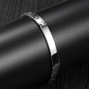 Polished stainless steel ID bracelet with rectangular plate on black display stand