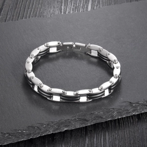 Industrial style stainless steel link bracelet with black accents and folding clasp