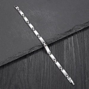 Minimalist silver stainless steel rectangular link bracelet with a modern industrial design
