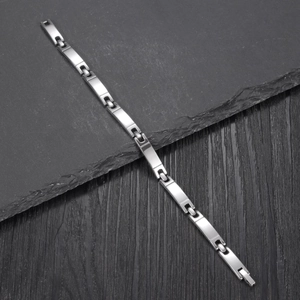 Minimalist silver stainless steel chain link bracelet shown from a 45-degree angle