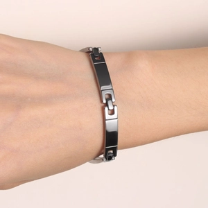 Minimalist stainless steel link bracelet for women with black and silver finish on wrist