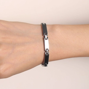 Minimalist silver and black stainless steel link bracelet for women worn on the wrist