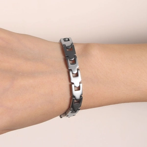 Minimalist stainless steel U-link chain bracelet for women on model's wrist with silver finish