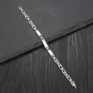 Minimalist silver stainless steel bracelet featuring geometric links and a polished finish