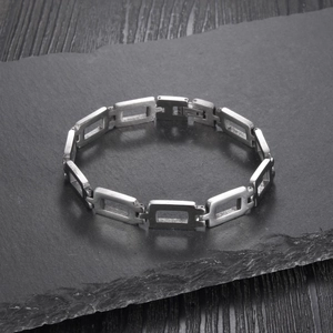 Minimalist silver stainless steel hollow link bracelet with a matte brushed finish