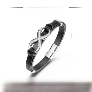 Detail of men's double-layer black leather bracelet with silver infinity symbol and magnetic clasp