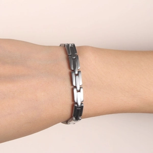Minimalist stainless steel chain bracelet for women on wrist in a clean side view