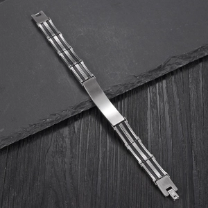 Industrial style men's stainless steel bracelet with black silicone and a blank metal plate